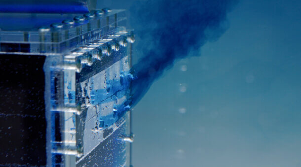 An underwater perspex model demonstrating building ventilation with dyes