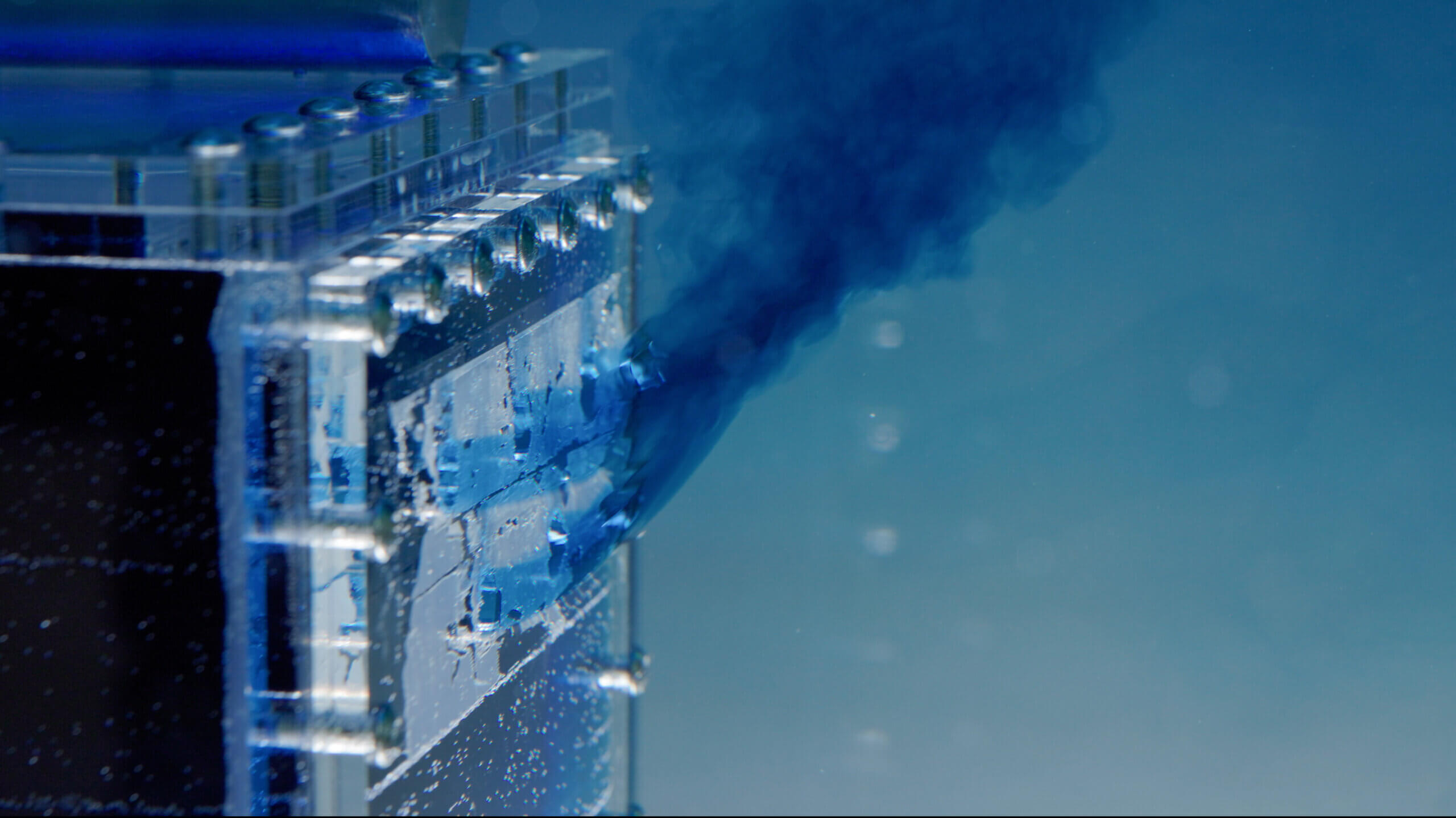 An underwater perspex model demonstrating building ventilation with dyes