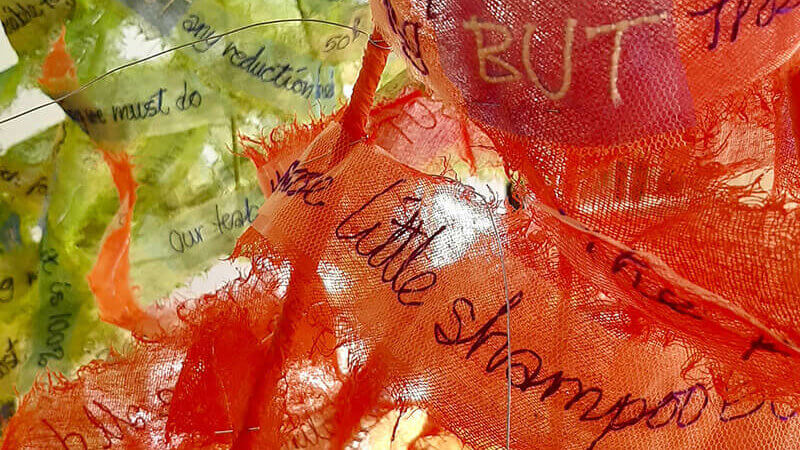 image of material hat with writing on it
